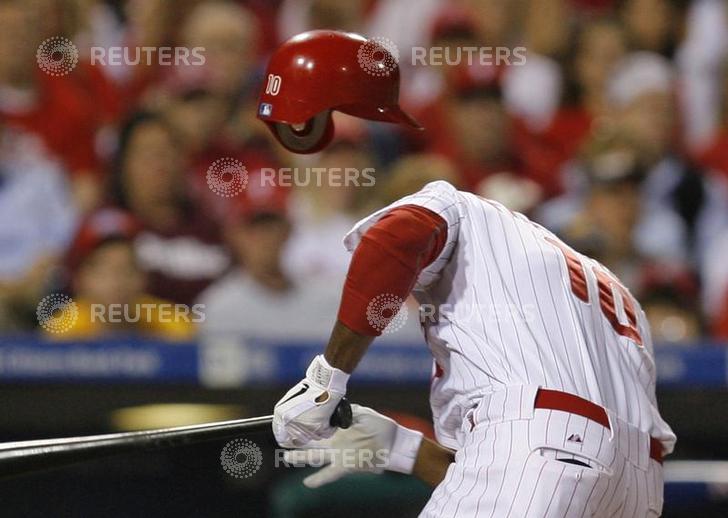 Philadelphia Phillies Francisco reacts after being hit in the head with a pitch in Game 2 of MLB National League Division Series baseball playoffs in Philadelphia