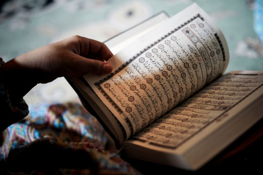 A young Bahraini Shiite Muslim girl reads the Koran, Islam's holy book, during the holy fasting month of Ramadan at a mosque in the village of Sanabis, west of Manama, on July 27, 2013. AFP PHOTO/MOHAMMED AL-SHAIKH        (Photo credit should read MOHAMMED AL-SHAIKH/AFP/Getty Images)